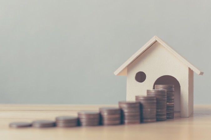 House with stack of coins