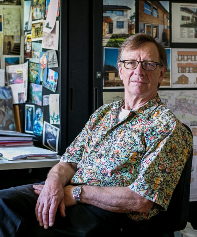 Jon Broome sitting in his home