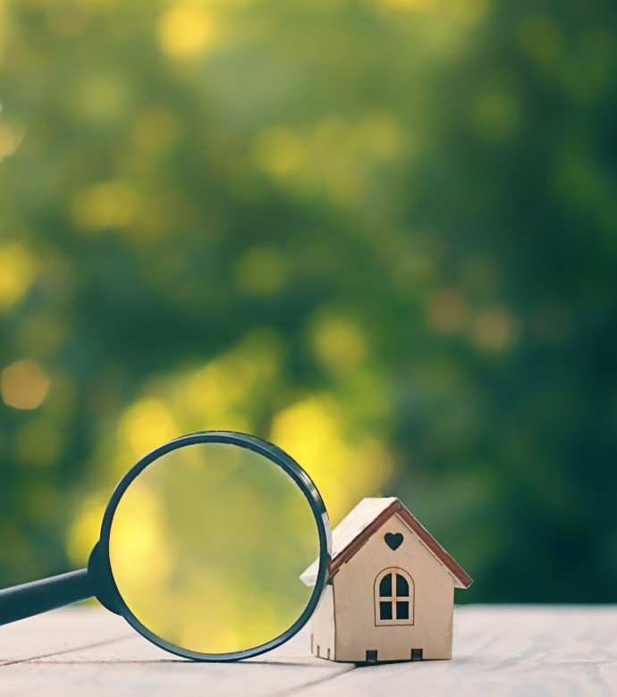 House with magnifying glass