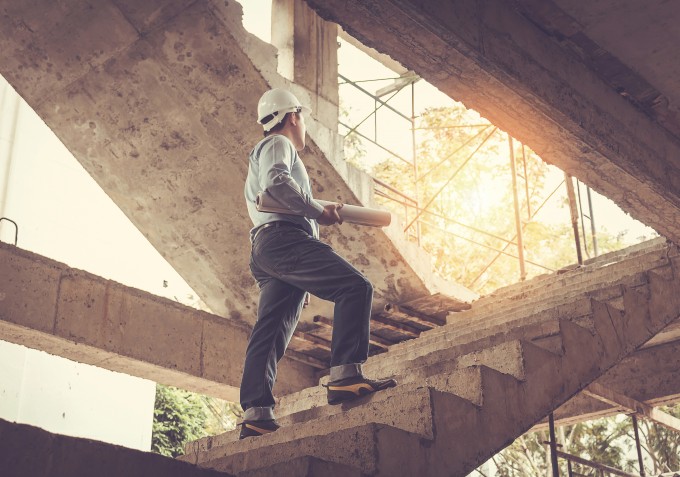 Builder climbing stairs