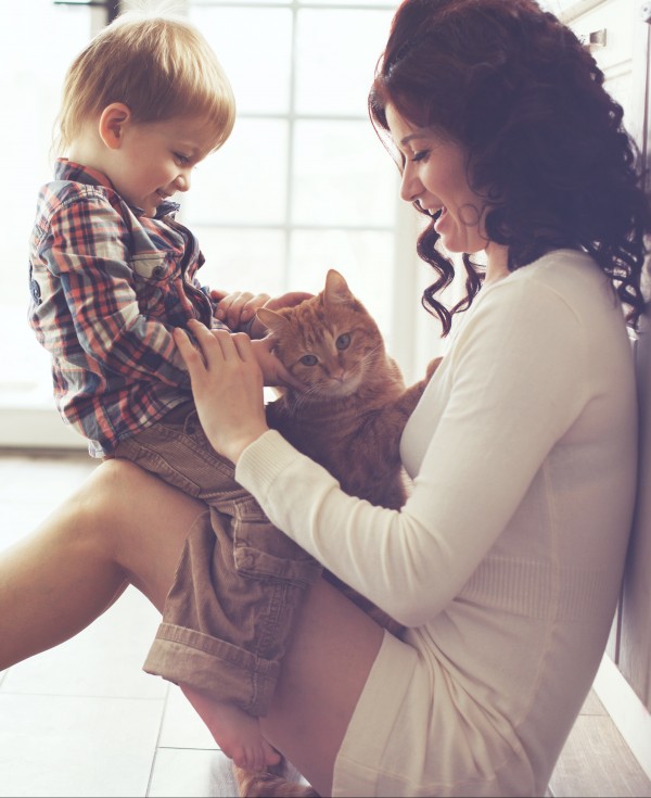 Mother and son sitting on floor