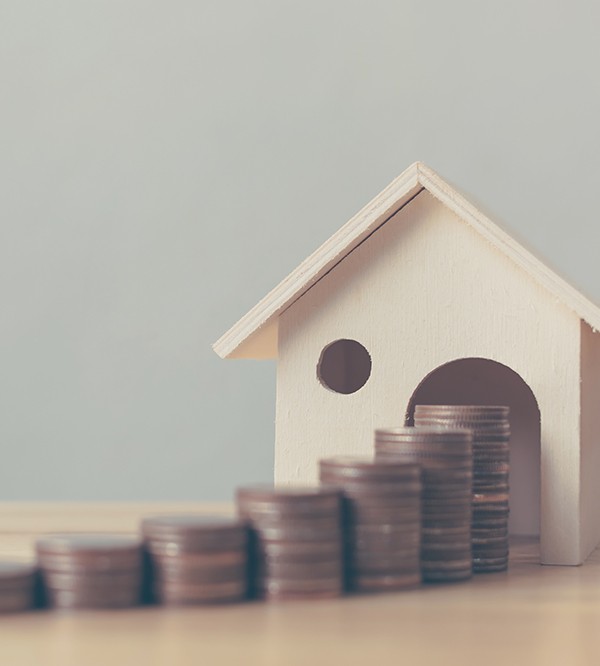 House with stack of coins