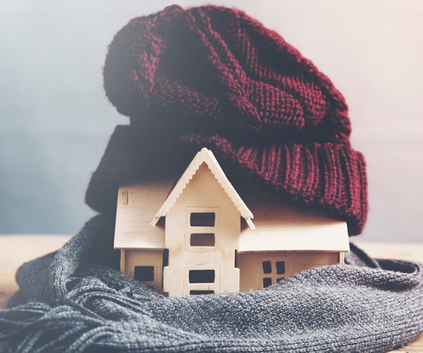 House wrapped in hat and scarf