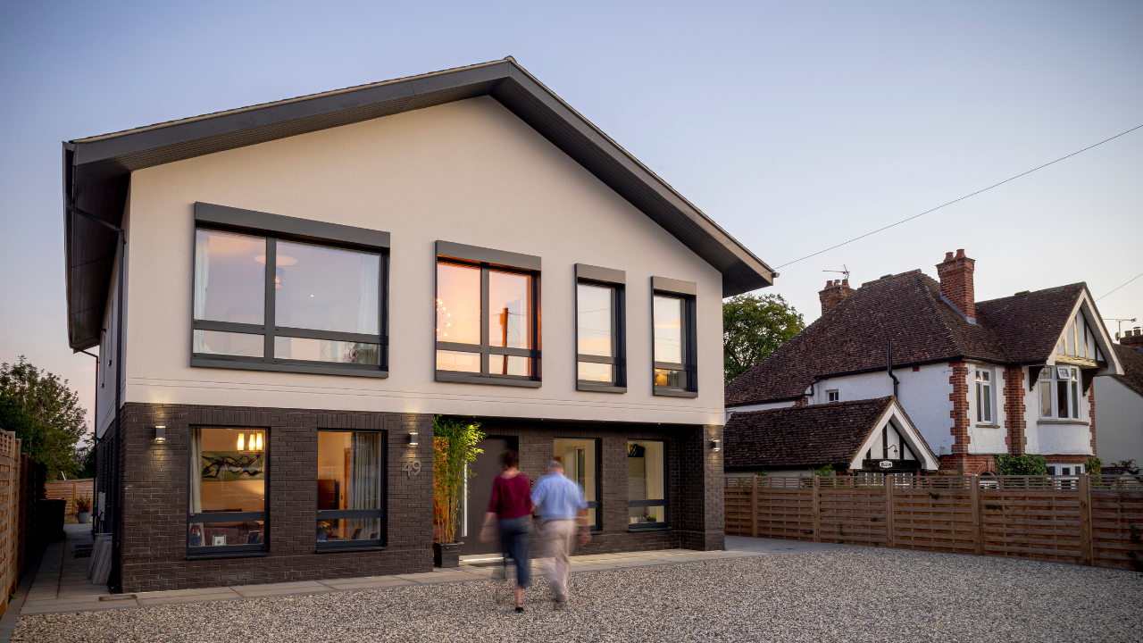 John Pryor walking into his Passivhaus self-build home